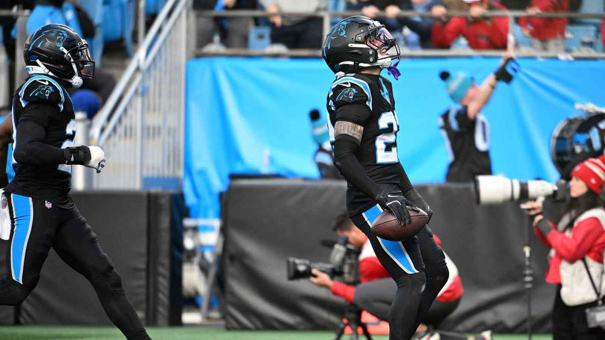 Carolina Panthers safety Lathan Ransom (22) celebrates with safety Nick Scott (21) after intercepting the ball to seal the victory in the fourth quarter at Bank of America Stadium. Mandatory Credit: Bob Donnan-Imagn Images