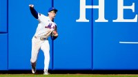 Carson Benge, of the New York Mets throws the ball into the infield from the warning track, Thursday, March 26, 2026..