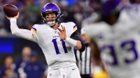 Minnesota Vikings quarterback Carson Wentz (11) drops back to pass against the Los Angeles Chargers during the second half at SoFi Stadium.