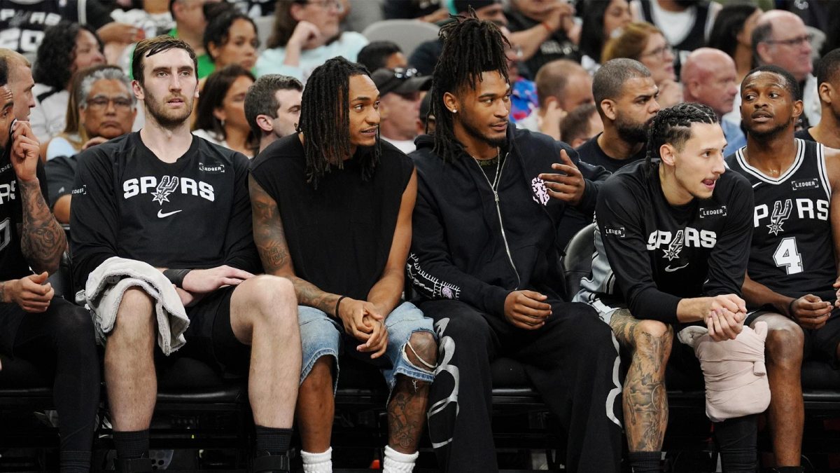 San Antonio Spurs guards Devin Vassell (24) and Stephon Castle (5) on the bench in the second half against the Indiana Pacers at Frost Bank Center.