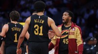 Cleveland Cavaliers guard Donovan Mitchell (45) celebrates with center Jarrett Allen (31) against the Miami Heat in the second quarter during game four for the first round of the 2025 NBA Playoffs at Kaseya Center.