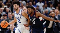 Duke Blue Devils guard Cayden Boozer (2) dribbles the ball against UConn Huskies guard Malachi Smith (0) in the second half during an Elite Eight game of the East Regional of the men's 2026 NCAA Tournament at Capital One Arena.
