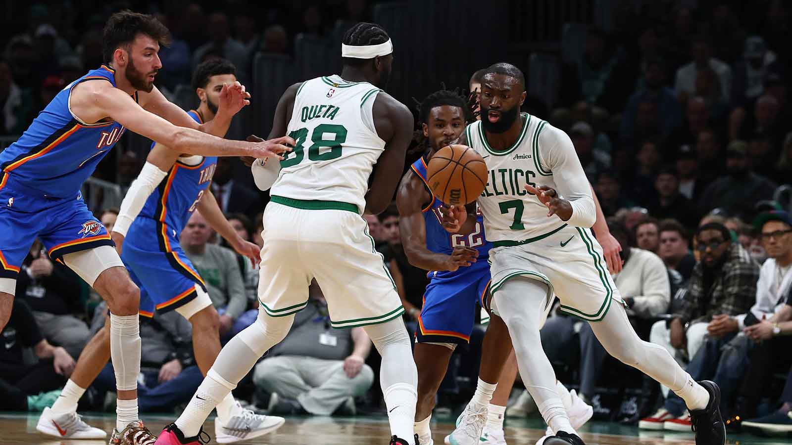 Celtics guard Jaylen Brown (7) goes around a pick set by center Neemias Queta (88) during the second quarter against the Oklahoma City Thunder at TD Garden