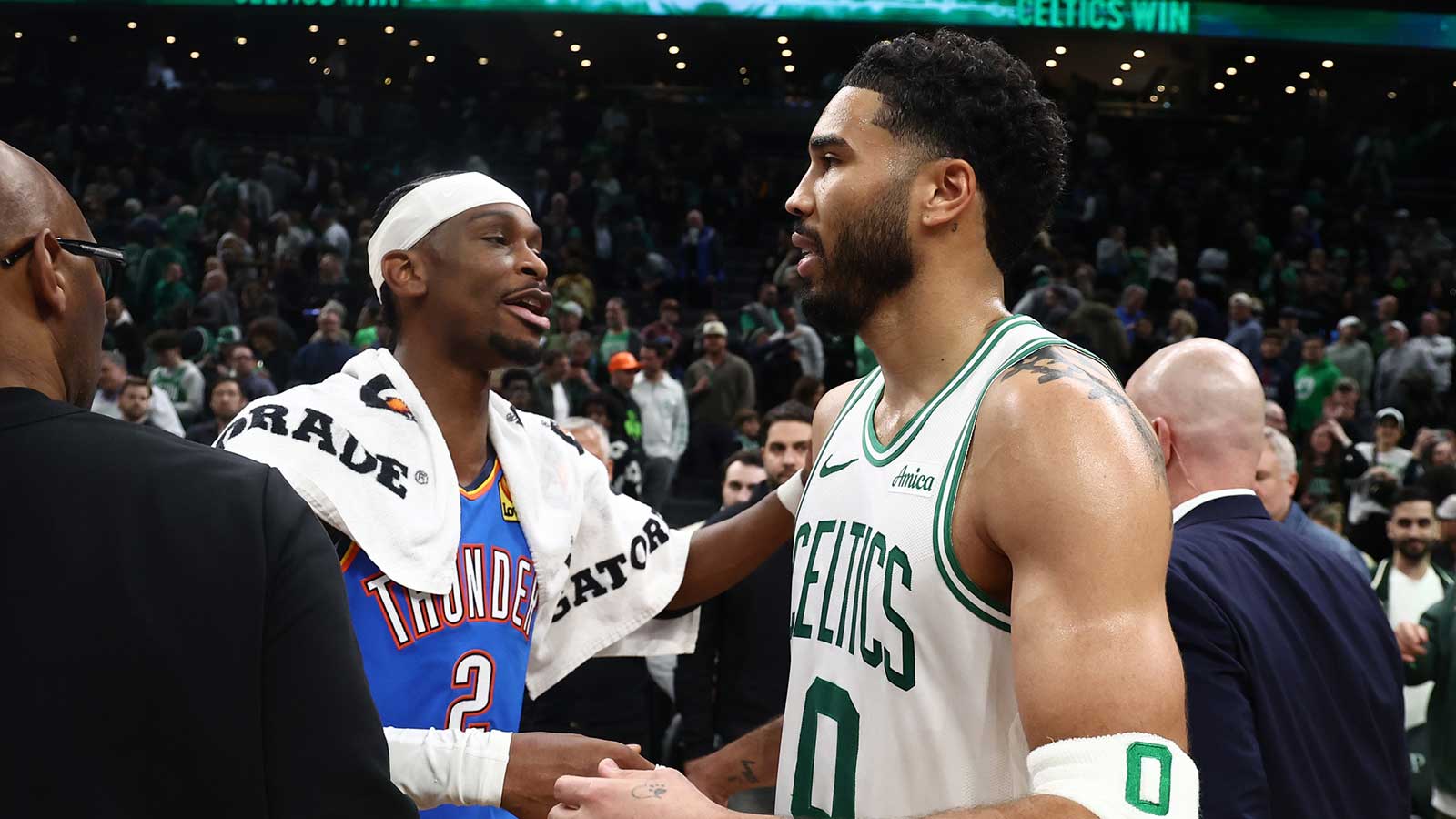 Thunder guard Shai Gilgeous-Alexander (2) talks with Boston Celtics forward Jayson Tatum (0) after their game at TD Garden