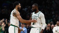Celtics guard Jaylen Brown (7) and forward Jayson Tatum (0) congratulate each other in the final seconds of the fourth quarter of their win over the Oklahoma City Thunder at TD Garden
