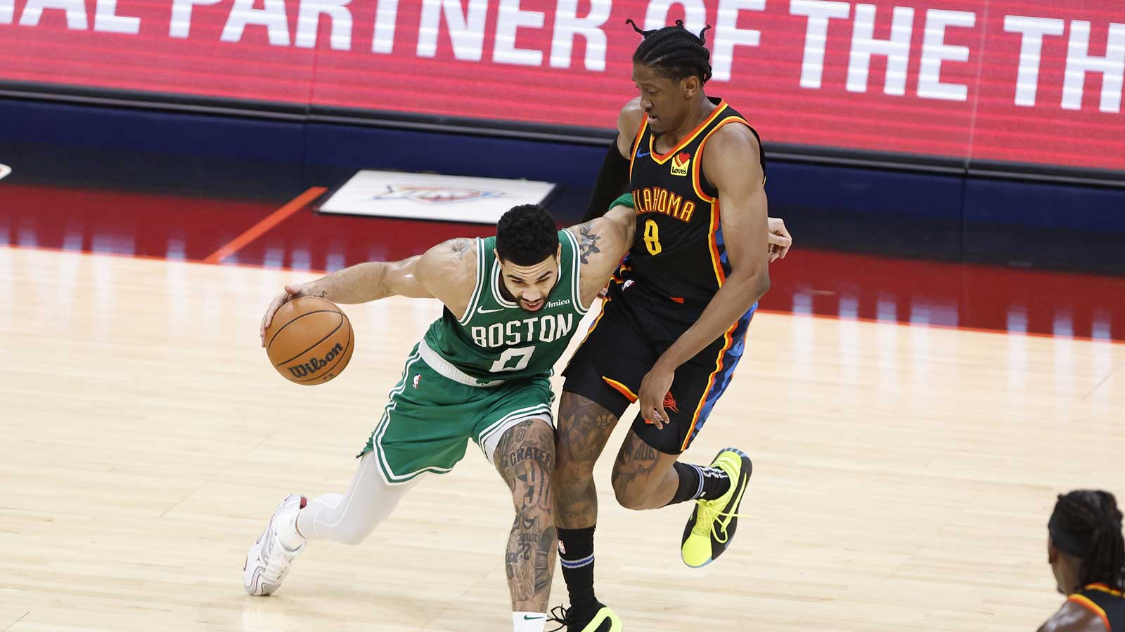 Celtics forward Jayson Tatum (0) drives to the basket as Oklahoma City Thunder forward Jalen Williams (8) defends during the third quarter at Paycom Center