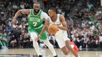 Celtics guard Jaylen Brown defends