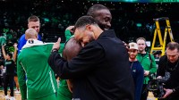 Boston Celtics guard Jaylen Brown (7) talks with Golden State Warriors guard Stephen Curry (30) after the game at TD Garden.