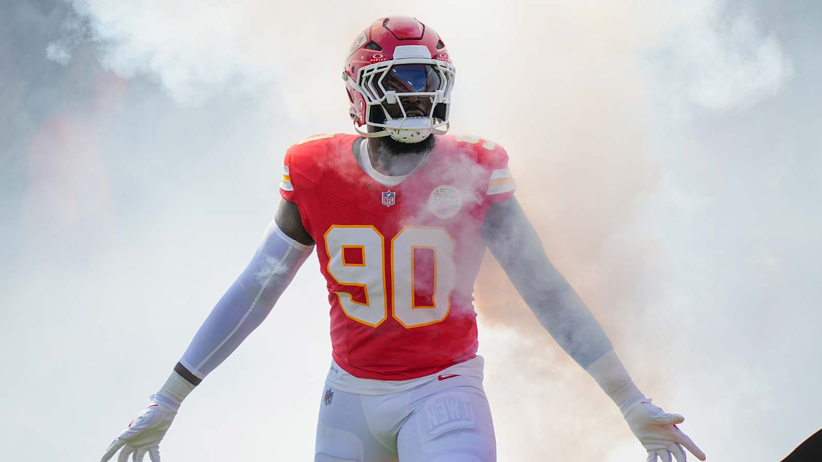 Kansas City Chiefs defensive end Charles Omenihu (90) runs onto the field during player introductions prior to the game against the Las Vegas Raiders at GEHA Field at Arrowhead Stadium.
