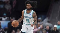 Charlotte Hornets guard Coby White (3) brings the ball up court against the Sacramento Kings during the second half at Spectrum Center.