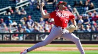 Cincinnati Reds pitcher Chase Burns (26) delivers a pitch in the first inning of a Cactus League game between the Cincinnati Reds and Cleveland Guardians, Saturday, Feb. 21, 2026, at Goodyear Ballpark in Goodyear, Ariz.