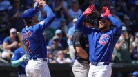 Chicago Cubs first baseman Michael Busch (29) celebrates with teammates after hitting a three run home run against the New York Yankees in the third inning at Sloan Park.