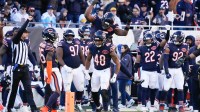 Chicago Bears linebacker Amen Ogbongbemiga (45) and linebacker D'Marco Jackson (48) react after a defensive stop during the second half at Soldier Field.