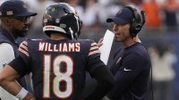 Chicago Bears head coach Ben Johnson talks with quarterback Caleb Williams (18) against the Dallas Cowboys during the second half at Soldier Field.