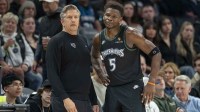 Minnesota Timberwolves head coach Chris Finch and guard Anthony Edwards (5) in the second half against the Memphis Grizzlies at Target Center.