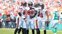 Tampa Bay Buccaneers wide receiver Chris Godwin Jr. (14) celebrates a touchdown with teammates during the first quarter against the Miami Dolphins at Hard Rock Stadium.