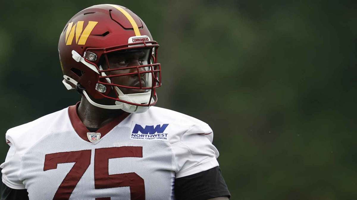 Washington Commanders guard Chris Paul (75) stands on the field during OTA workouts at Commanders Park.
