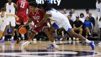 BYU Cougars forward Khadim Mboup (7) defends Texas Tech Red Raiders guard Christian Anderson (4) during the first half at Marriott Center.