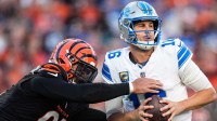 Detroit Lions quarterback Jared Goff (16) is sacked by Cincinnati Bengals defensive end Trey Hendrickson (91) during the second half at Paycor Stadium in Cincinnati on Sunday, Oct. 5, 2025.