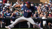 United States pitcher Clayton Kershaw (22) throws against the Colorado Rockies in the third inning at Salt River Fields.