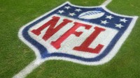 The NFL shield logo on the field at Allegiant Stadium. Mandatory Credit: Kirby Lee-Imagn Images