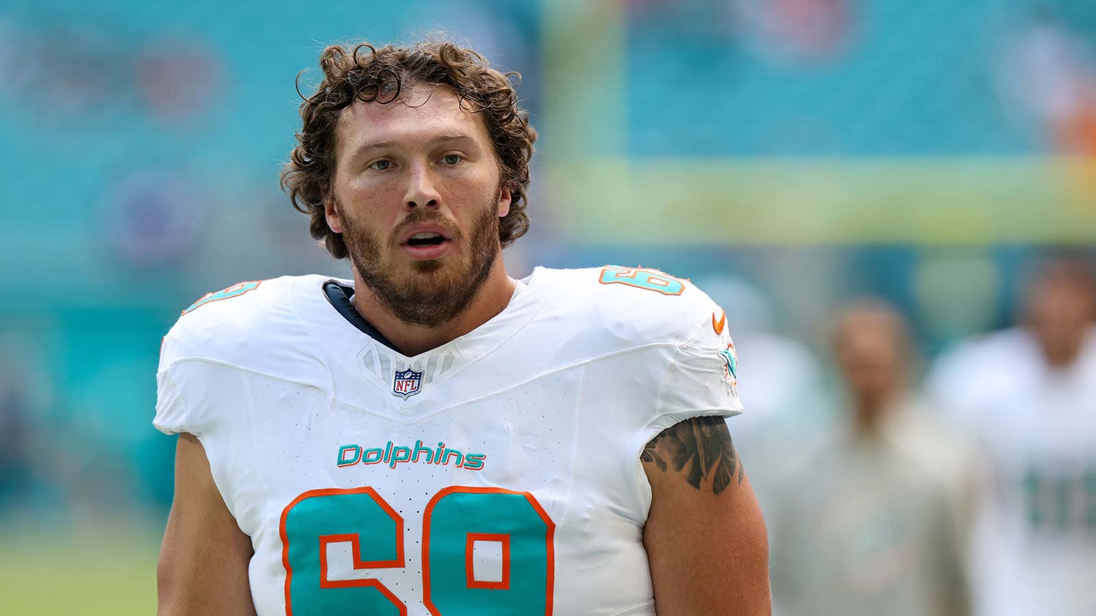 Miami Dolphins guard Cole Strange (69) looks on before a game against the New England Patriots at Hard Rock Stadium. 