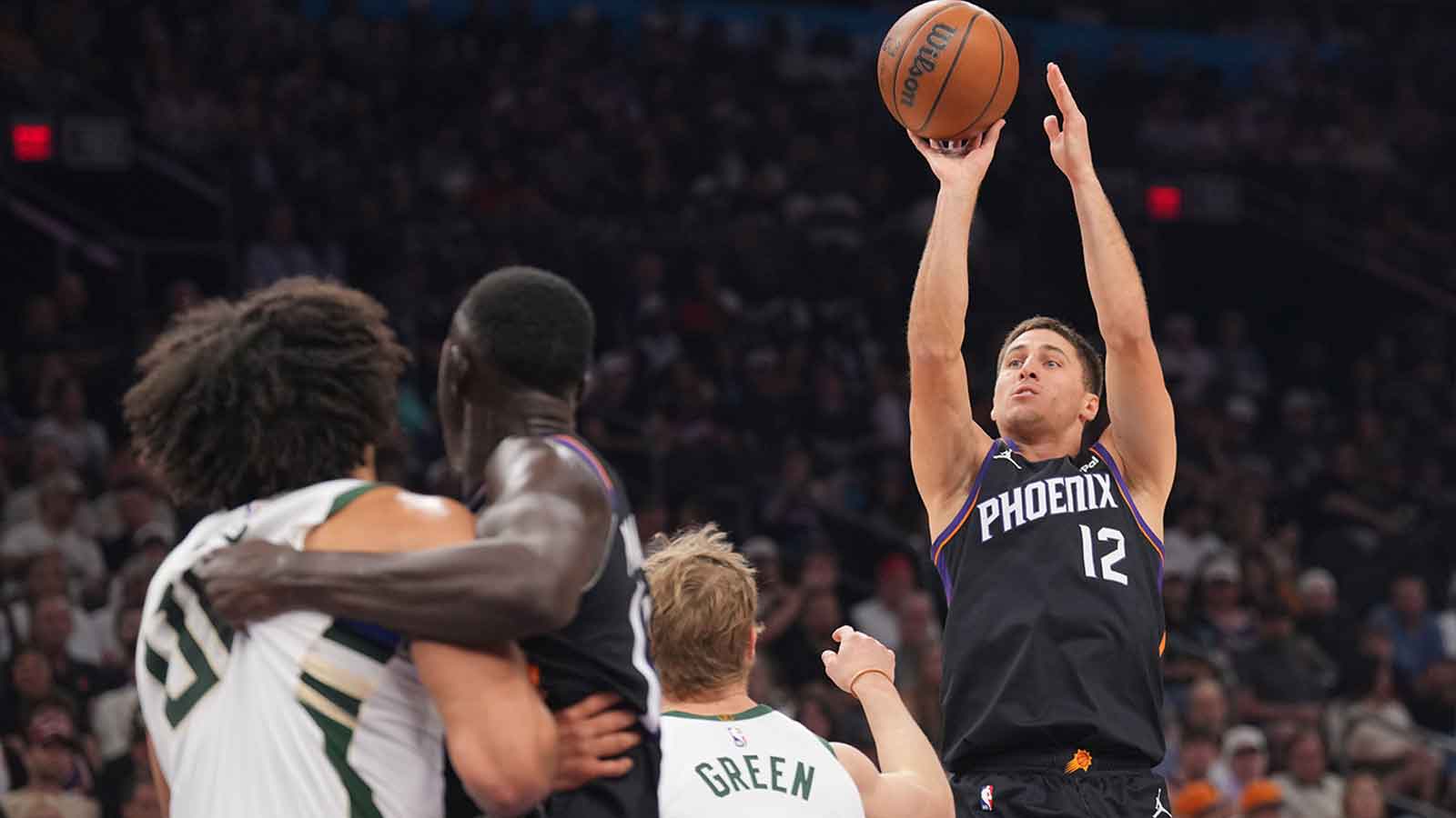 Phoenix Suns guard Collin Gillespie (12) shoots against the Milwaukee Bucks during the first half at Mortgage Matchup Center. 