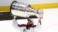 Colorado Avalanche center Nazem Kadri (91) celebrates with the Stanley Cup trophy after defeating the Tampa Bay Lightning during game six of the 2022 Stanley Cup Final at Amalie Arena.