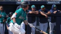 Seattle Mariners shortstop Colt Emerson (85) hits a single against the Cleveland Guardians in the second inning at Peoria Sports Complex