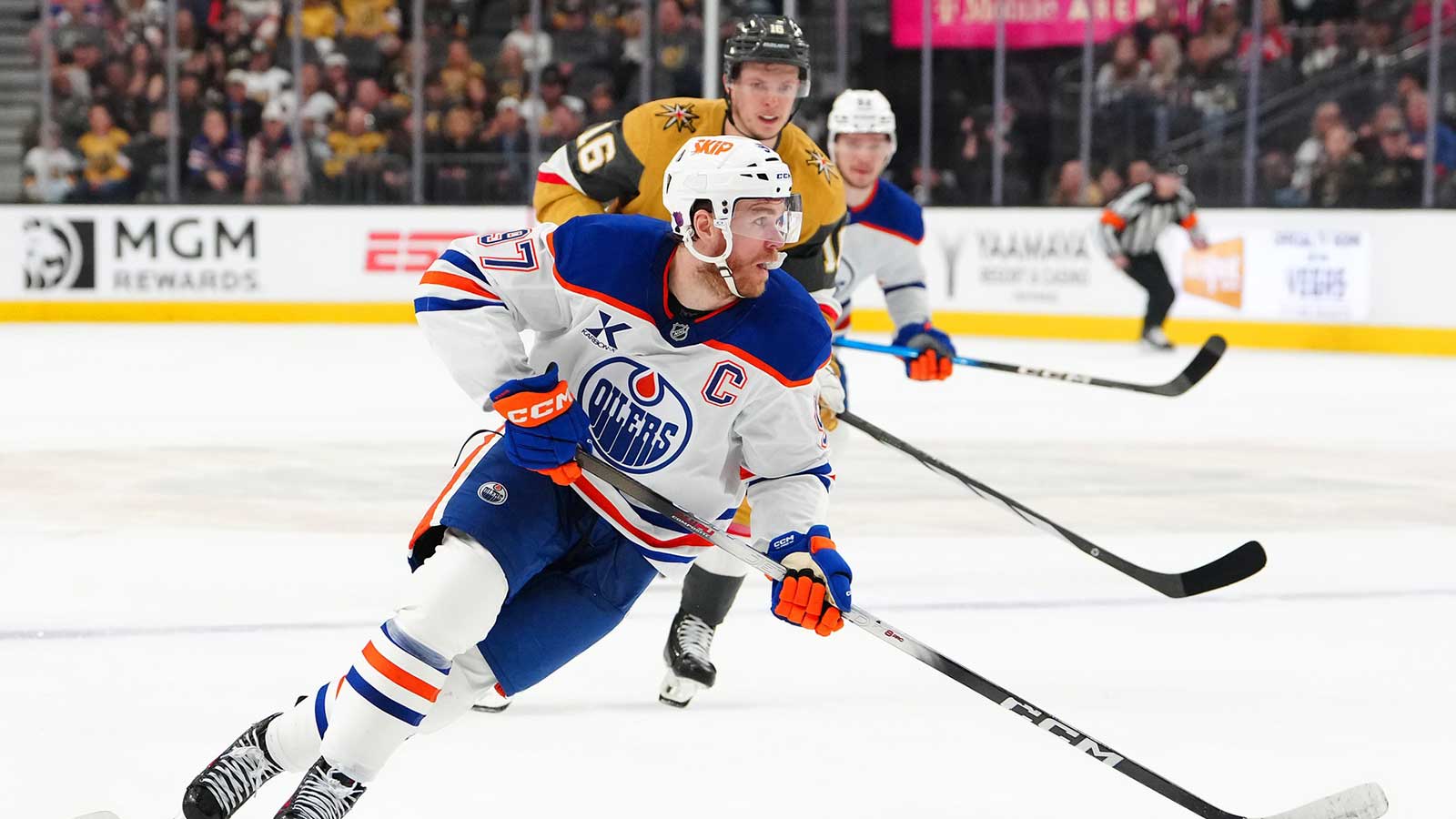Edmonton Oilers center Connor McDavid (97) controls the puck ahead of Vegas Golden Knights right wing Pavel Dorofeyev (16) during the first period at T-Mobile Arena.