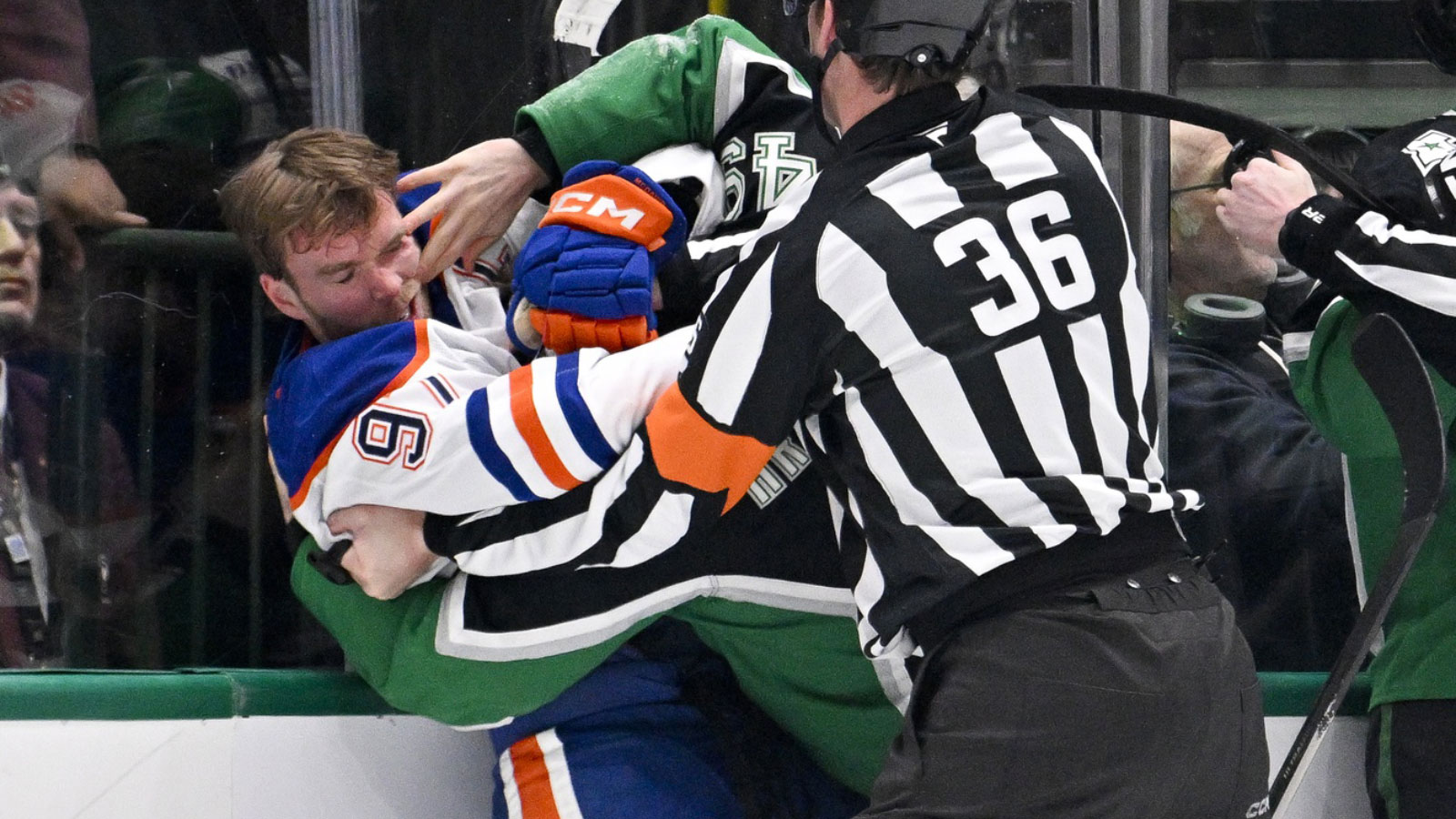 Edmonton Oilers center Connor McDavid (97) fights with Dallas Stars center Justin Hryckowian (49) during the second period at the American Airlines Center.