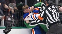 Dallas Stars center Justin Hryckowian (49) fights Edmonton Oilers center Connor McDavid (97) during the second period at the American Airlines Center.