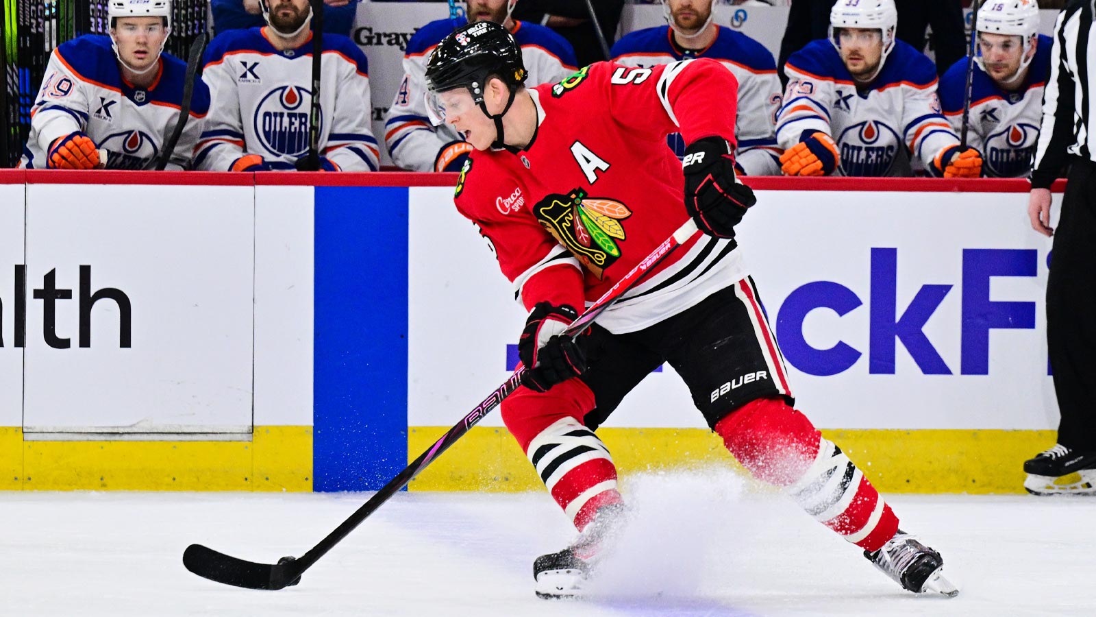 Chicago, Illinois, USA; Chicago Blackhawks defenseman Connor Murphy (5) skates with the puck against the Edmonton Oilers during the first period at the United Center. 