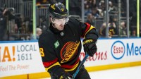 Vancouver Canucks forward Conor Garland (8) handles the puck in warm up prior to a game against the Dallas Stars at Rogers Arena.