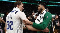 Boston Celtics forward Jayson Tatum (0) and Dallas Mavericks forward Cooper Flagg (32) talk after their game at TD Garden. Mandatory Credit: Winslow Townson-Imagn Images