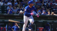 Chicago Cubs third baseman Alex Bregman (3) hits a single against the Colorado Rockies in the first inning at Sloan Park.