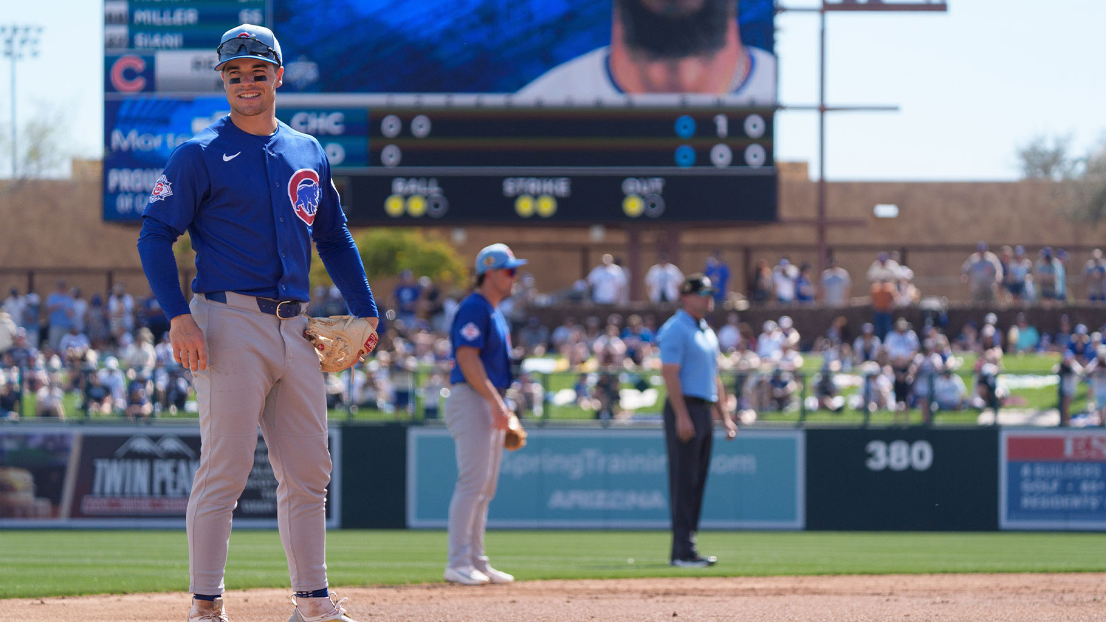 Chicago Cubs infielder Matt Shaw (6) smiles at fans between plays during the second inning of a spring training game against the Los Angeles Dodgers at Camelback Ranch-Glendale.