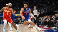 Detroit Pistons guard Cade Cunningham (2) drives past Atlanta Hawks guard Nickeil Alexander-Walker (7) in the first quarter at Little Caesars Arena.