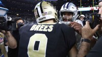 Dallas Cowboys quarterback Dak Prescott (4) meets with New Orleans Saints quarterback Drew Brees (9) after the game at AT&T Stadium.
