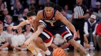 Connecticut Huskies guard Silas Demary Jr. (2) fights for the ball against St. John's Red Storm guard Dylan Darling (0) during the second half of the men's Big East Conference Tournament Championship game at Madison Square Garden.