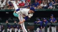 Texas Rangers pitcher Danny Coulombe (54) follows through on a pitch during the seventh inning against the Miami Marlins at Globe Life Field.