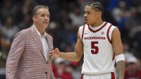 Arkansas Razorbacks head coach John Calipari talks with guard Darius Acuff Jr. (5) during a time out against the Oklahoma Sooners during the first half at Bridgestone Arena.
