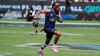 Team USA quarterback Darrell Doucette III (Housh Doucette III) carries the ball during the Fanatics Flag Football Classic at BMO stadium.