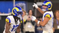 Los Angeles Rams wide receiver Davante Adams (17) celebrates with wide receiver Puka Nacua (12) after a touchdown against the Tampa Bay Buccaneers at SoFi Stadium.
