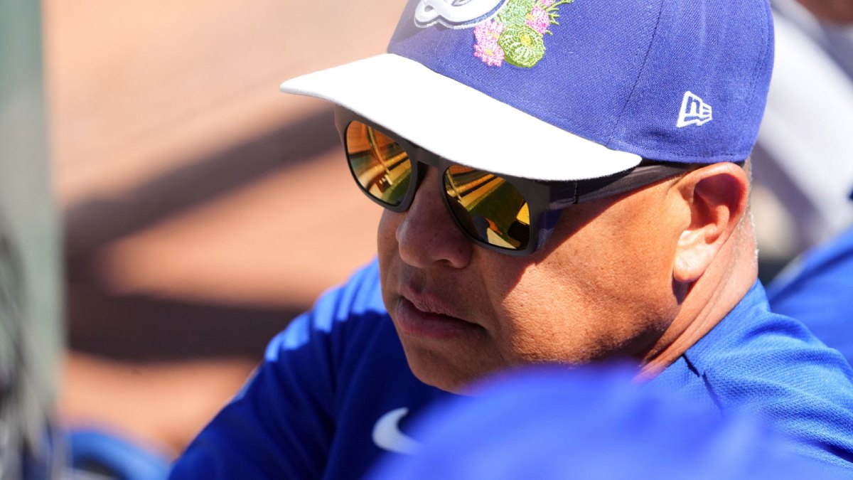 Los Angeles Dodgers manager Dave Roberts (30) looks on against the Cincinnati Reds during the second inning at Goodyear Ballpark.