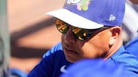 Los Angeles Dodgers manager Dave Roberts (30) looks on against the Cincinnati Reds during the second inning at Goodyear Ballpark.