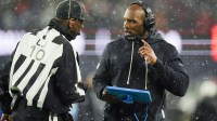 Houston Texans head coach DeMeco Ryans speaks with the referee during the second half against New England Patriots in an AFC Divisional Round game at Gillette Stadium.