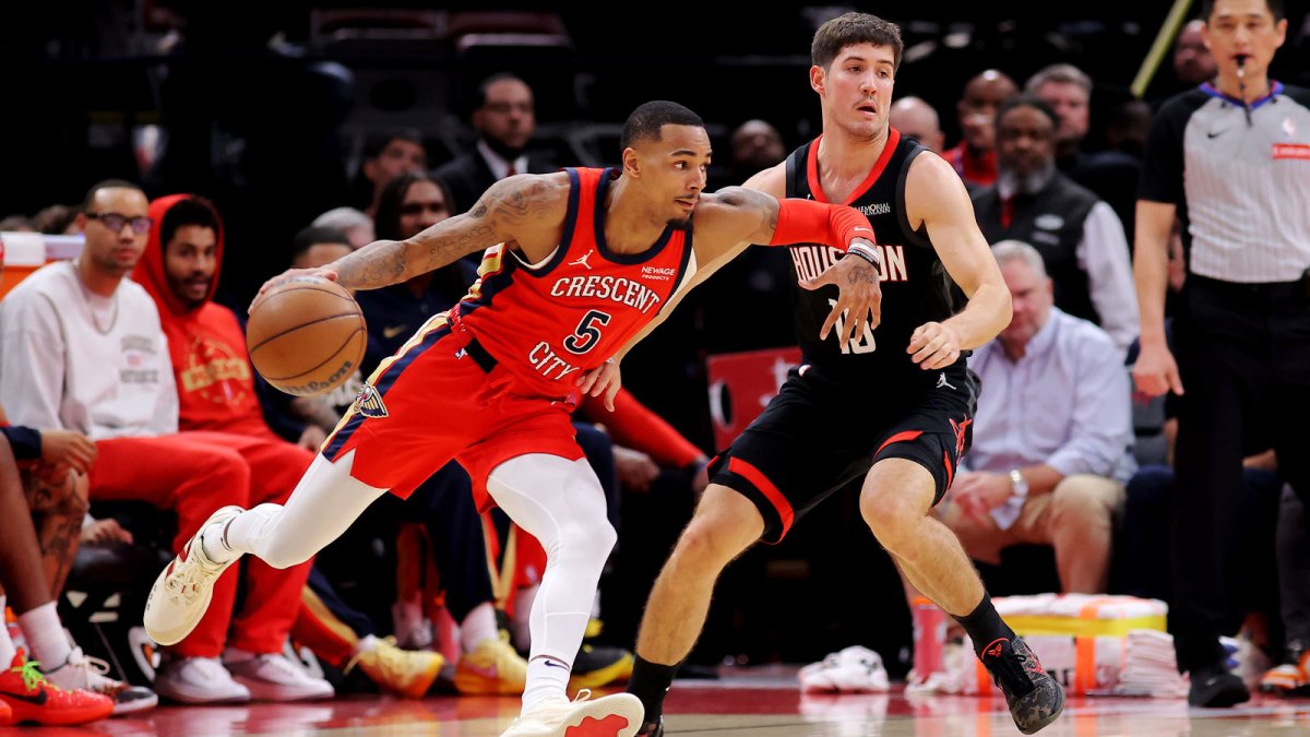 New Orleans Pelicans guard Dejounte Murray (5) handles the ball against Houston Rockets guard Reed Sheppard (15) during the second quarter at Toyota Center.