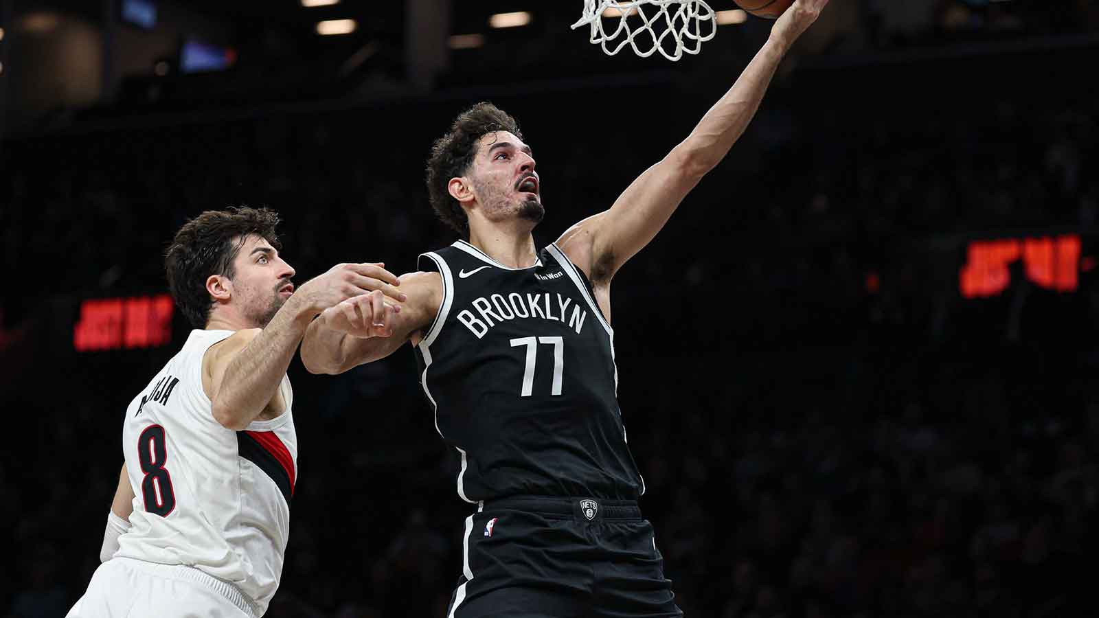 Brooklyn Nets guard Ben Saraf (77) goes to the basket as Portland Trail Blazers forward Deni Avdija (8) defends during the second half at Barclays Center.