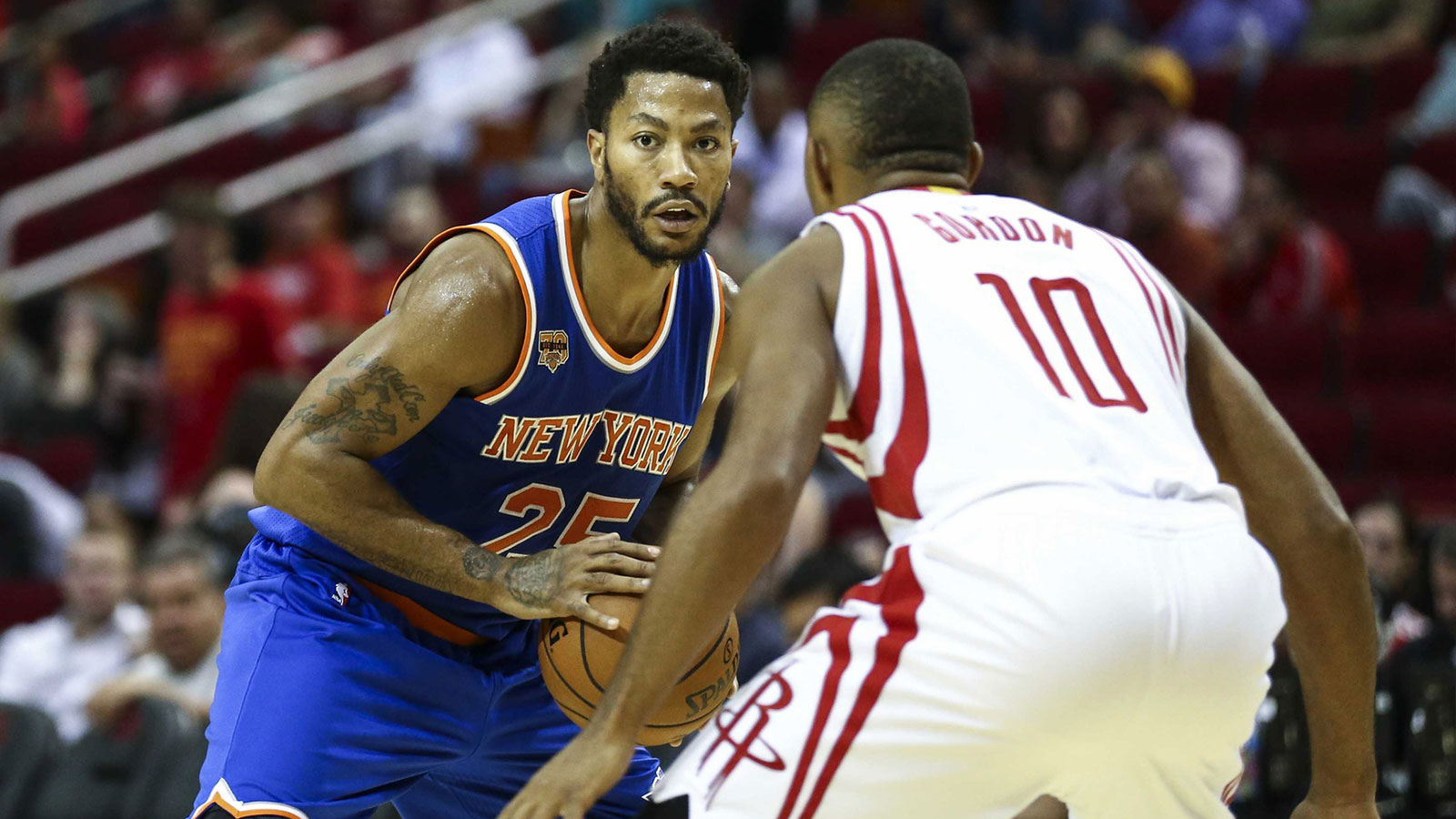 New York Knicks guard Derrick Rose (25) controls the ball as Houston Rockets guard Eric Gordon (10) defends during the third quarter at Toyota Center. The Rockets won 130-103. Mandatory Credit: 